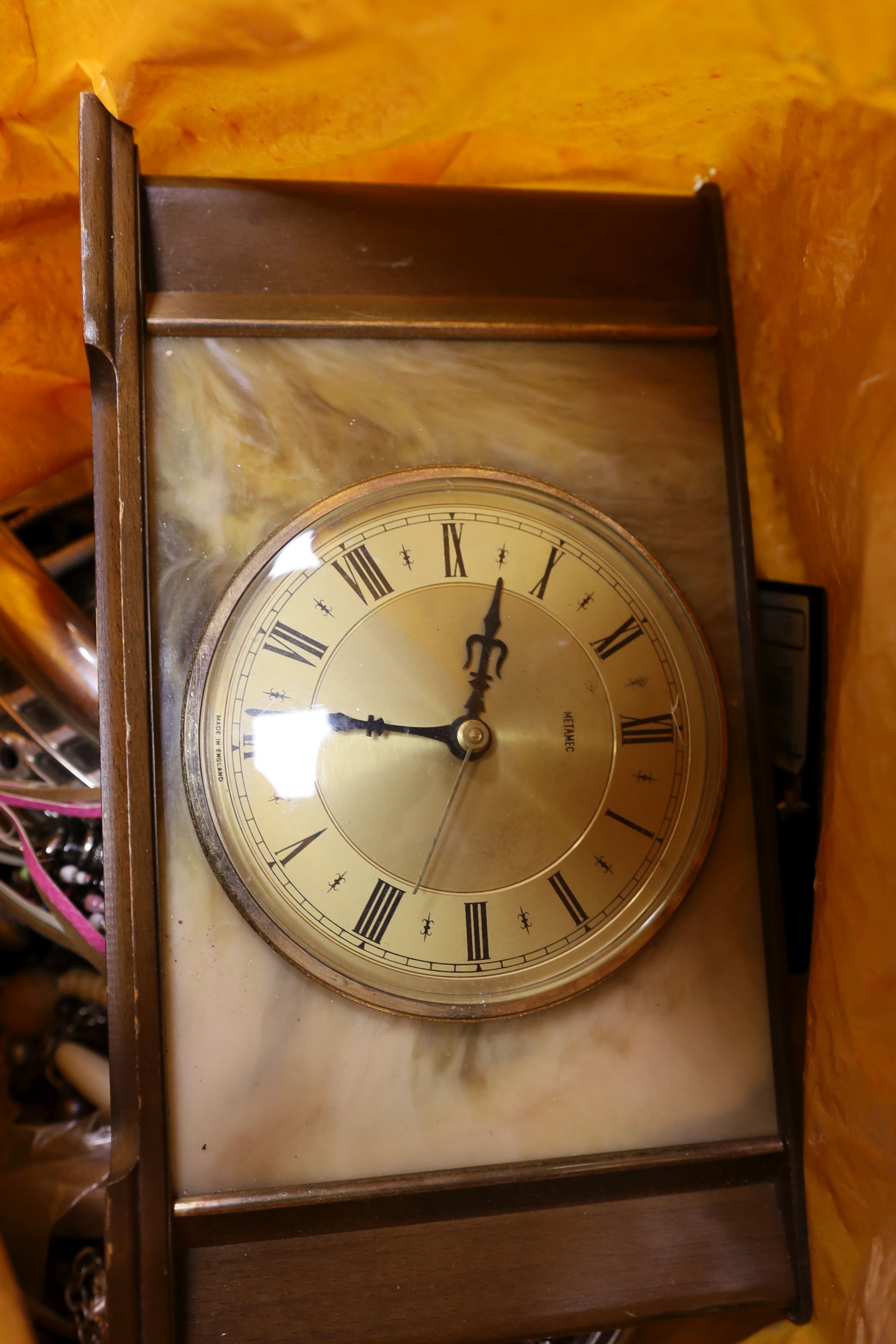 A large quantity of assorted costume jewellery, watches, clocks etc.